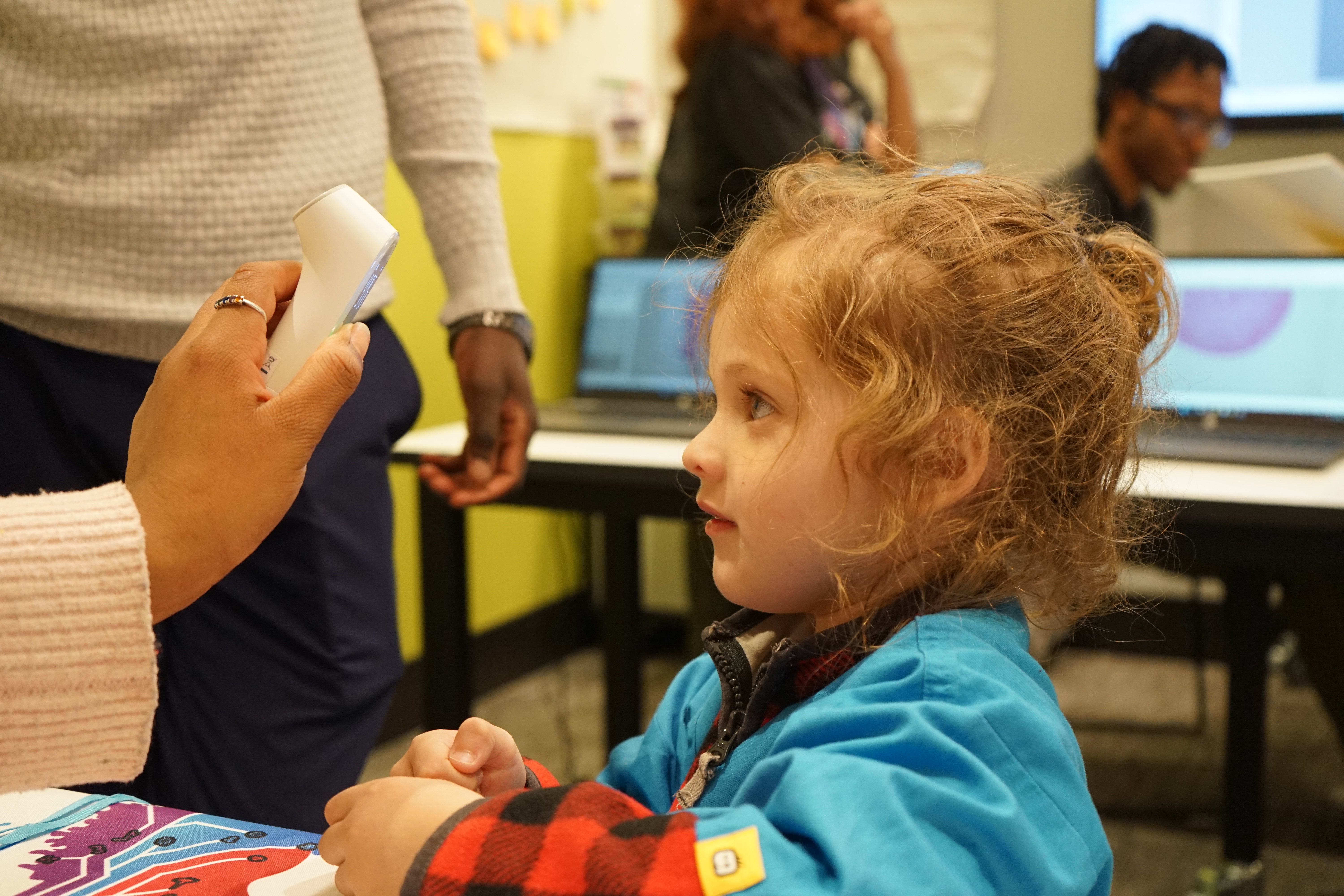 Students and families attending a community-oriented tech program